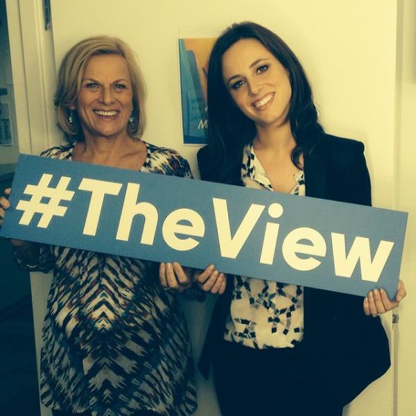 Alicia Menendez and mother Jane Jacobsen holding a sign saying #TheView