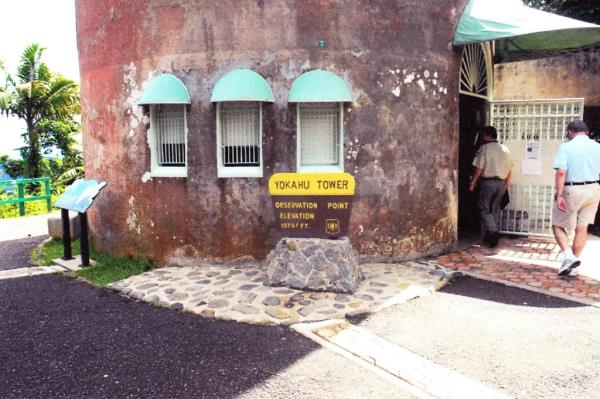 A man who appears to be Bob Menendez walks behind a man in United States Forest Service uniform into the entrance of Yokahú Tower, which is in El Yunque Natio<em></em>nal Forest in Puerto Rico.