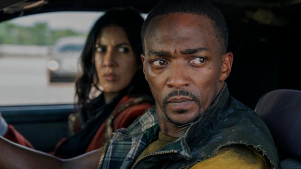 Stephanie Beatriz and Anthony Mackie in a car together. 