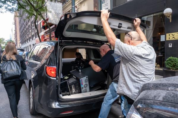 Suffolk County Police pulled computers and evidence from his midtown office Friday afternoon after his Thursday evening arrest.