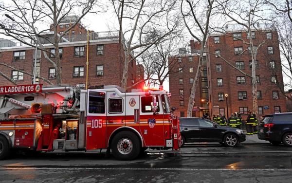 Fire truck in front of housing project in Brooklyn. 