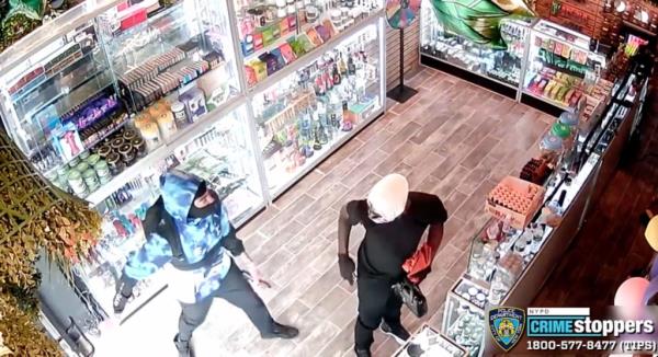 Screenshot from a surveillance video shows robbers at Puffume Smoke Shop at 43-45 44th Street in Queens