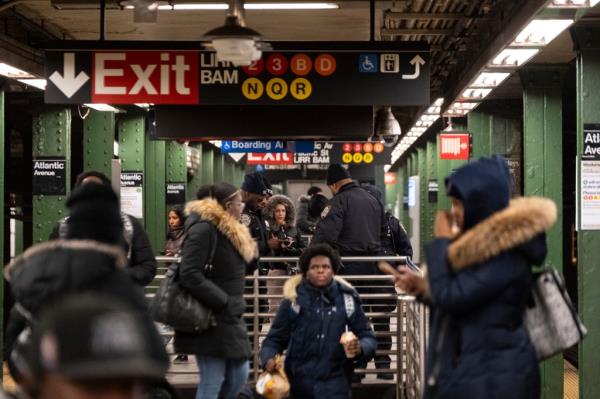 Police officers patrolling at Barclay Station, Brooklyn during a citywide manhunt for a potential serial stabber