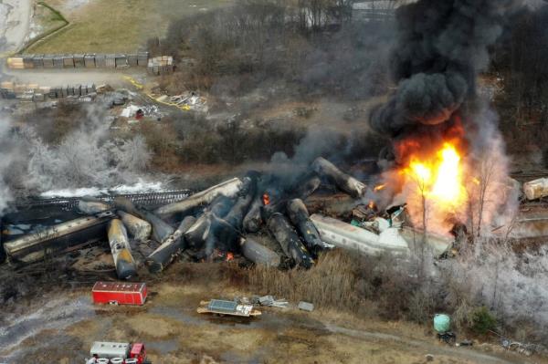 Portions of a Norfolk Southern freight train that derailed the night before burn in East Palestine, Ohio, Feb. 4, 2023.