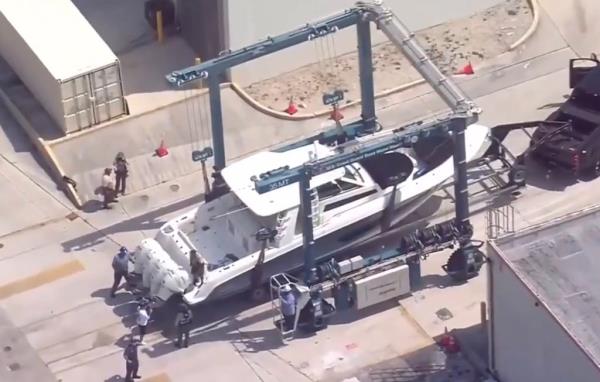 Boston whaler with four outboard motors on trailer 