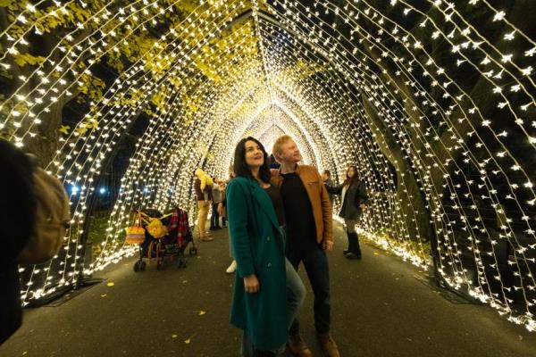 Couple walking through Lightscape