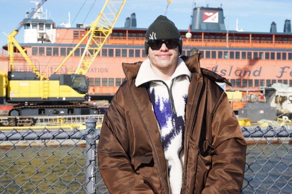 Davidson poses in front of the John F. Kennedy ferry.