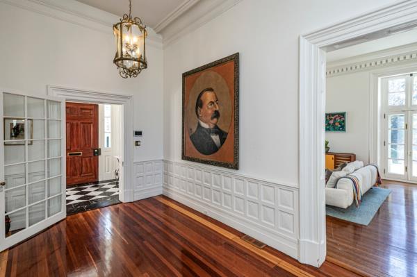 A painting of the president currently hangs in the home. 