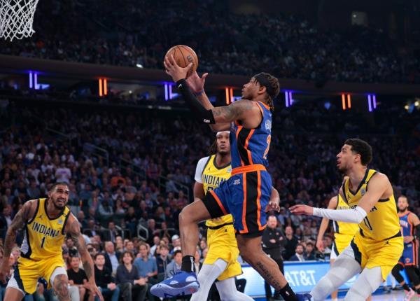 Knicks guard Miles McBride #2 goes up for a shot