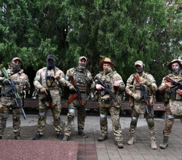 Fighters of Wagner private mercenary group pose for a picture as they get deployed near the headquarters of the Southern Military District in the city of Rostov-on-Don, Russia, June 24, 2023. 