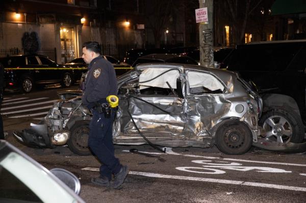 Police are seen at the scene of a fatal two car accident on Irving Ave. and Stockholm St. in Brooklyn, Monday, Jan. 8, 2024. 