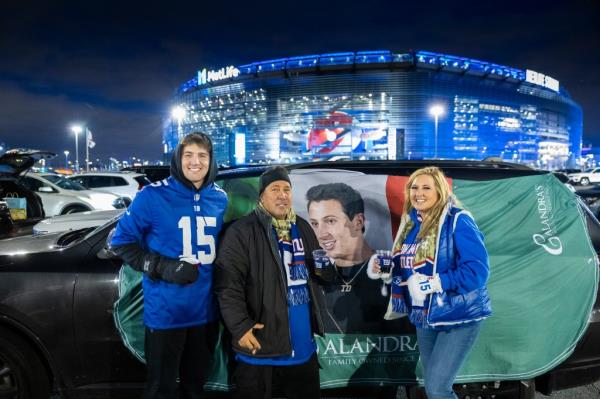 The family of New York Giants Tommy DeVito, Max DeVito brother, age 23, left, Tom DeVito, dad and Lexi DeVito, mom tailgate before a game against the Green Bay Packers at MetLife Stadium, Monday,