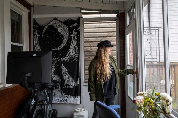 Amber Escudero-Ko<em></em>ntostathis looks over her backyard at her home in Washington, D.C., on March 10, 2023.