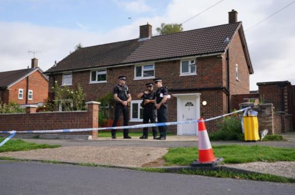 Surrey Police officers outside a property on Hammond Road in Woking, Surrey, wher<em></em>e a 10-year-old girl was found dead after officers were called to the address on Thursday following a co<em></em>ncern for safety. Picture date: Friday August 11, 2023. PA Photo. See PA story POLICE Woking. Photo credit should read: Jo<em></em>nathan Brady/PA Wire