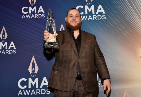 Luke Combs poses with the award for single of the year for 