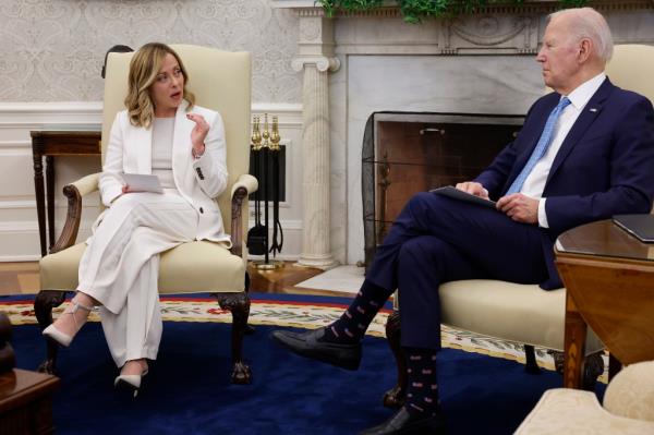 President Joe Biden (R) and Italian Prime Minister Giorgia Meloni deliver prepared remarks during a meeting in the Oval Office at the White House.