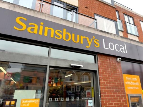 Sainsbury's Localstore sign on building exterior, store frontage