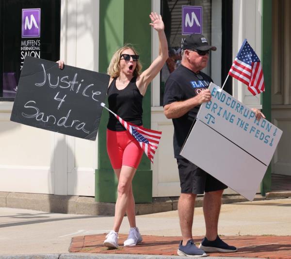 Demo<em></em>nstrators hold signs for justice for Sandra Birchmore at Town Hall in Stoughton on Saturday, July 20, 2024.