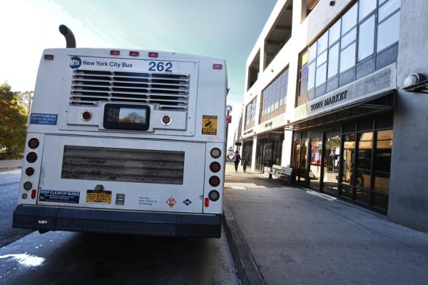 A photo showing an MTA bus parked just outside the Town Market.