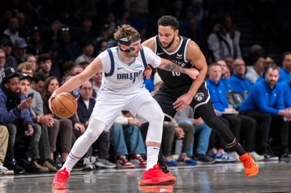 Dallas Mavericks guard Luka Do<em></em>ncic (77) drives against Brooklyn Nets guard Ben Simmons (10) in the first half at Barclays Center, Tuesday, Feb. 6, 2024, in Brooklyn, NY. 