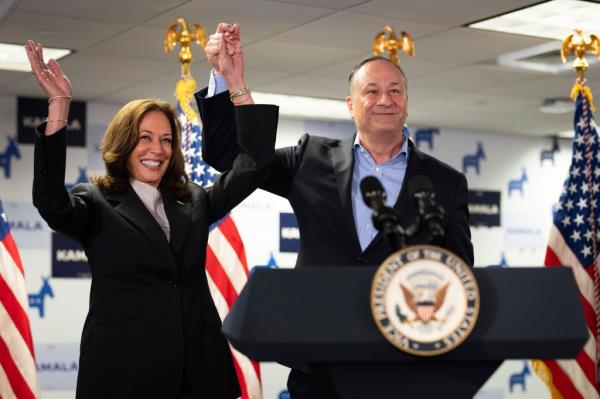 Vice President Kamala Harris, left, and second gentleman Doug Emhoff address staff at her campaign headquarters in Wilmington, Del., Monday, July 22, 2024.