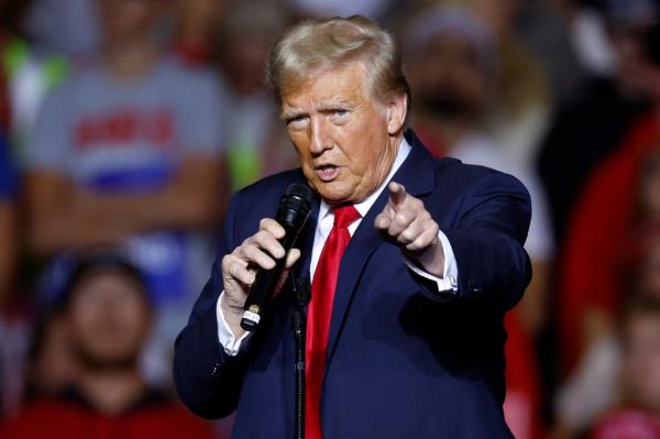 Former US President and Republican presidential candidate Do<em></em>nald Trump gestures as he speaks at a campaign rally at the Fiserv Forum in Milwaukee, Wisconsin, November 1, 2024.