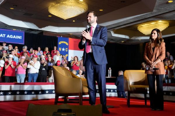 Republican vice president nominee Sen. JD Vance speaking at a campaign event while Danica Patrick watches on in Greensboro, N.C., October 10, 2024.