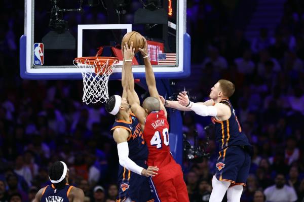 Josh Hart (L.) blocks Nicolas Batum during the Knicks' Game 4 win over the 76ers on April 28, 2024. 