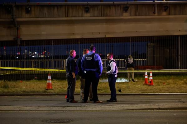 Police respond to the scene of a shooting  on Beach 95th Street near Beach Channel Drive in Rockaway Beach.