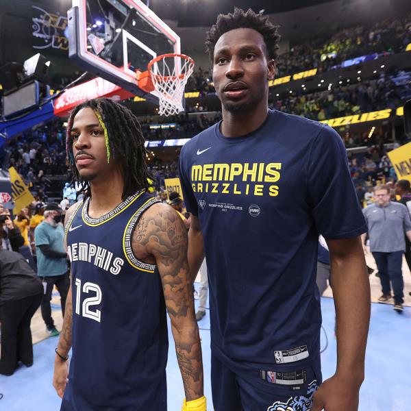 Ja Morant #12 of the Memphis Grizzlies and Jaren Jackson Jr. #13 of the Memphis Grizzlies walk off the court after Round 1 Game 2 of the 2022 NBA Playoffs on April 19, 2022 at FedExForum in Memphis, Tennessee.  