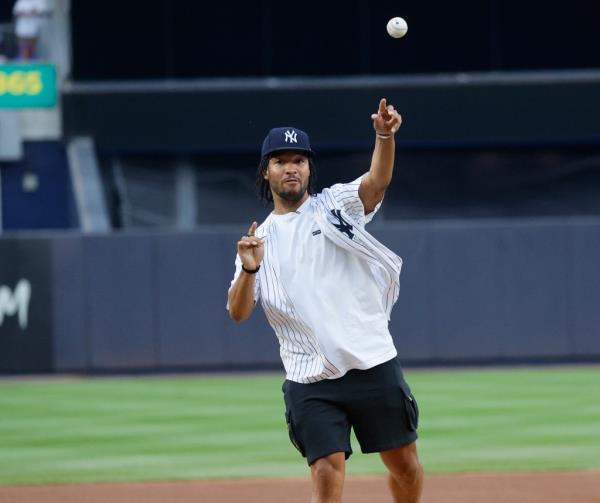 New York Knicks guard Jalen Brunson throwing the ceremo<em></em>nial first pitch at a New York Mets vs. New York Yankees game at Yankee Stadium on July 24, 2024.