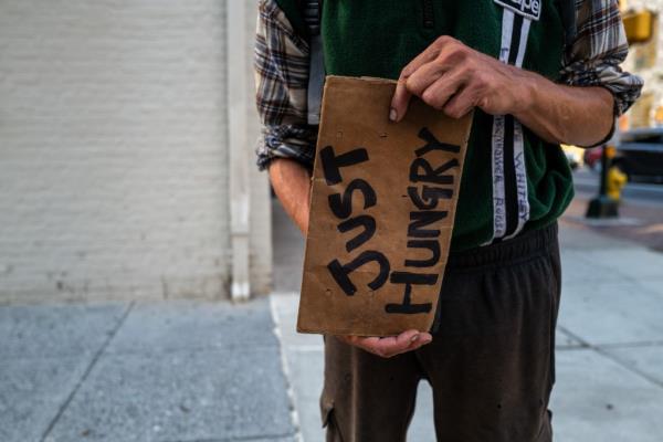 A man panhandles in the downtown area on August 01, 2024 in Harrisburg, Pennsylvania. 