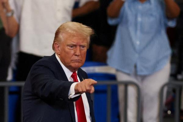 Republican presidential nominee and former U.S. President Do<em></em>nald Trump gestures during a campaign rally held with Republican vice presidential nominee Senator JD Vance, in Atlanta, Georgia, U.S., August 3, 2024.  