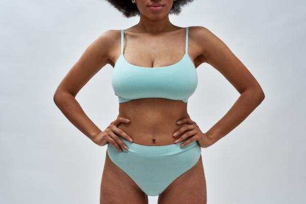 Cropped shot of perfect voluptuous young woman wearing blue underwear 