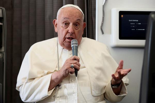 Pope Francis holds a news co<em></em>nference aboard the papal plane on his flight back after his 12-day journey across Southeast Asia and Oceania, September 13, 2024. 