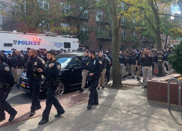 The troopers gathered with NYPD officers along Roosevelt Avenue near 83rd and 84th streets.