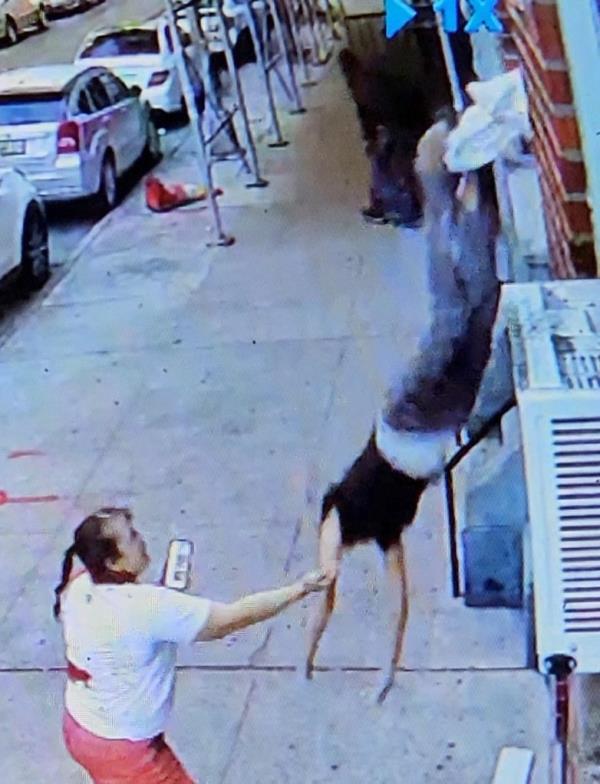 A woman pushed from window.