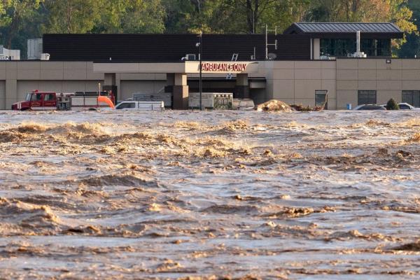 Flood waters from te Nolichucky River rage near Unicoi County Hospital in Erwin, Tenn. on Sept. 27, 2024.