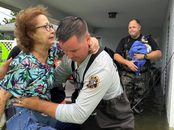 The Venice Police Department assist residents after they became flooded in from coastal floods on Sept. 27, 2024.