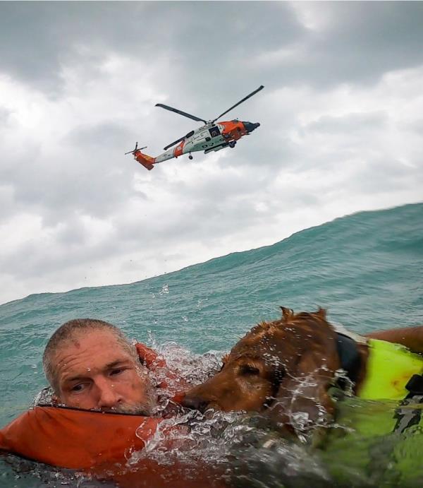 A sailor and his dog were saved by the US Coast Guard 25 miles off the coast of Florida on Sept. 26, 2024.