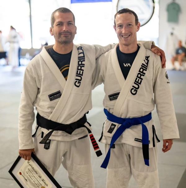 me<em></em>ta CEO Mark Zuckerberg (right) is seen standing next to his jiu-jitsu coach, Dave Camarillo, after the tech mogul earned a blue belt.