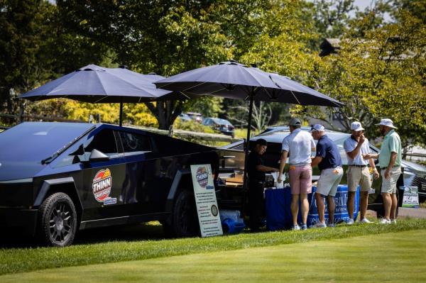 Famished golfers enjoyed the pizza from the Cybertrucks Monday.