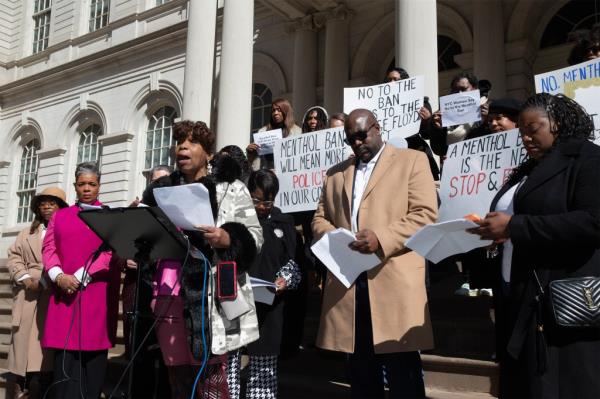 Gwen Carr, mother of Eric Garner speaking against the ban on menthol cigarettes, saying it was discriminatory, on the steps of City Hall Thursday March 9th. At right is George Floyd's brother Philo<em></em>nese and his  wife Keeta Floyd. nypostinhouse