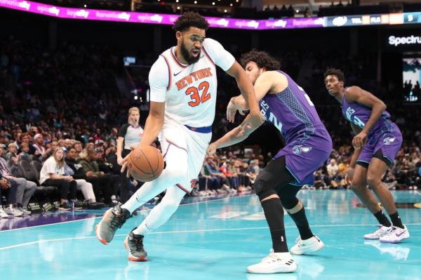 Karl-Anthony Towns #32 of the New York Knicks dribbles the ball during the game against the Charlotte Hornets