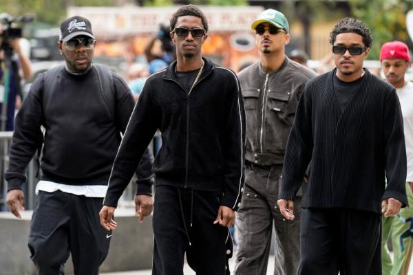 Combs' sons (from right) Justin Dior Combs, Quincy Brown and King Combs arrive at Manhattan federal court.