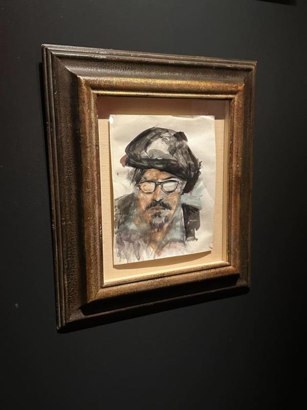 A self-portrait of Depp with a berret and sunglasses