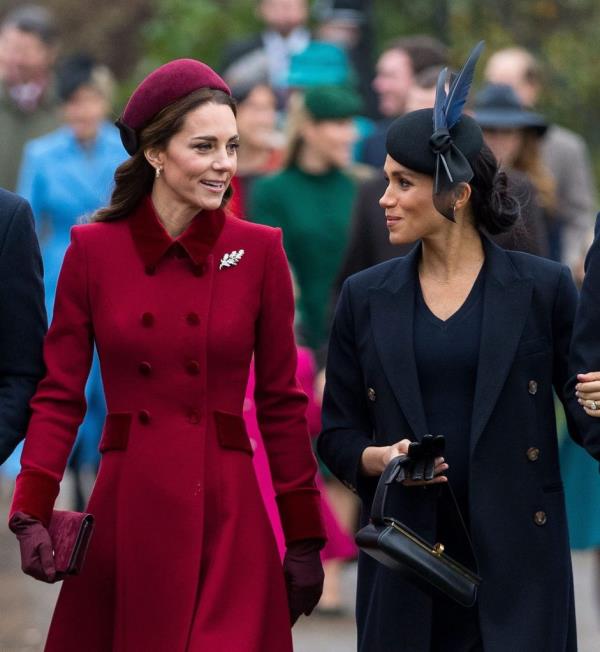 Catherine Duchess of Cambridge, Meghan Duchess of Sussex and others walking together in a churchyard on Christmas Day.