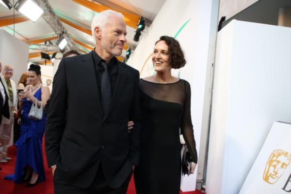 LONDON, ENGLAND - FEBRUARY 19: Writer and director Martin McDo<em></em>nagh and Phoebe Waller-Bridge attend the EE BAFTA Film Awards 2023 at The Royal Festival Hall on February 19, 2023 in London, England. (Photo by Lia Toby/BAFTA/Getty Images for BAFTA)