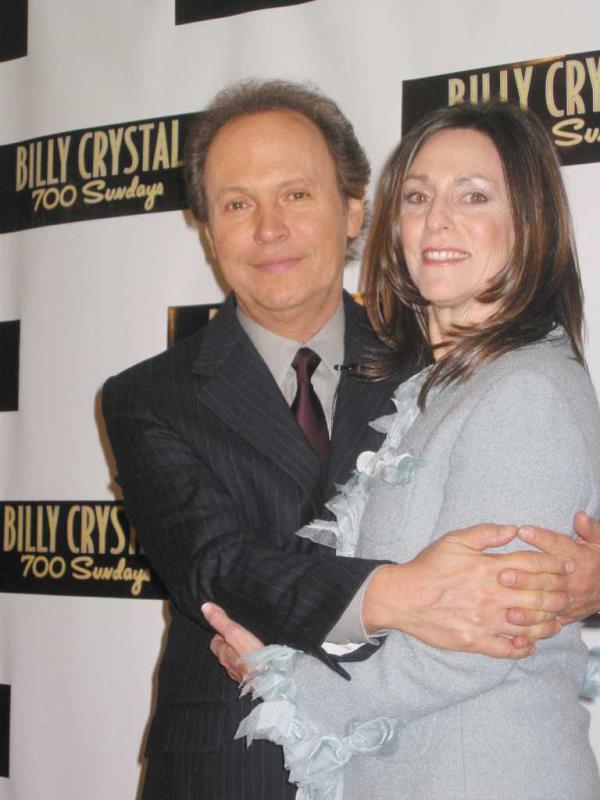 Billy Crystal and wife, Janice, hugging at the opening night party for '700 Sundays' at Tavern on the Green in Central Park West.