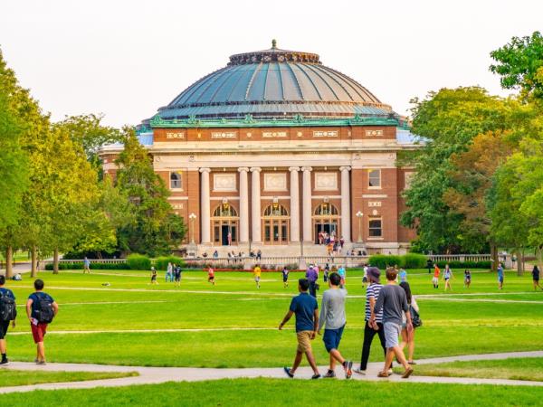 Students walking around college campus.